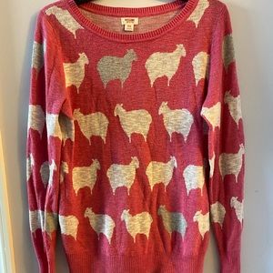 Pink sweater with sheep pattern